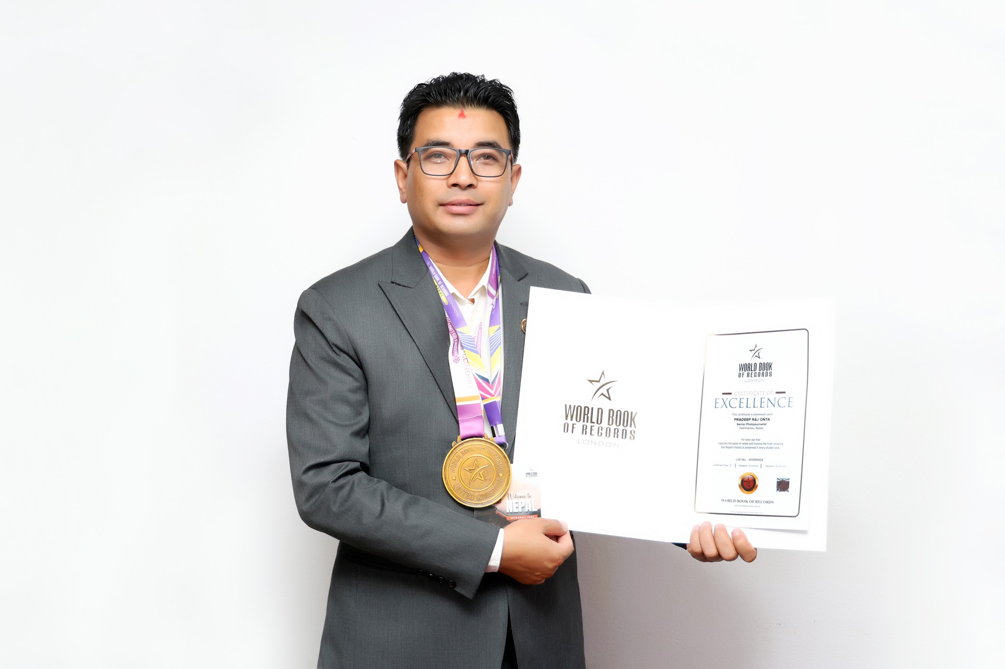 Senior Photojournalist Pradeep Raj Onta Honored by World Book of Records